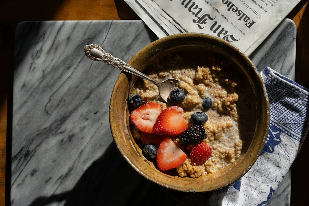 Oatmeal topped with fresh strawberries and blueberries